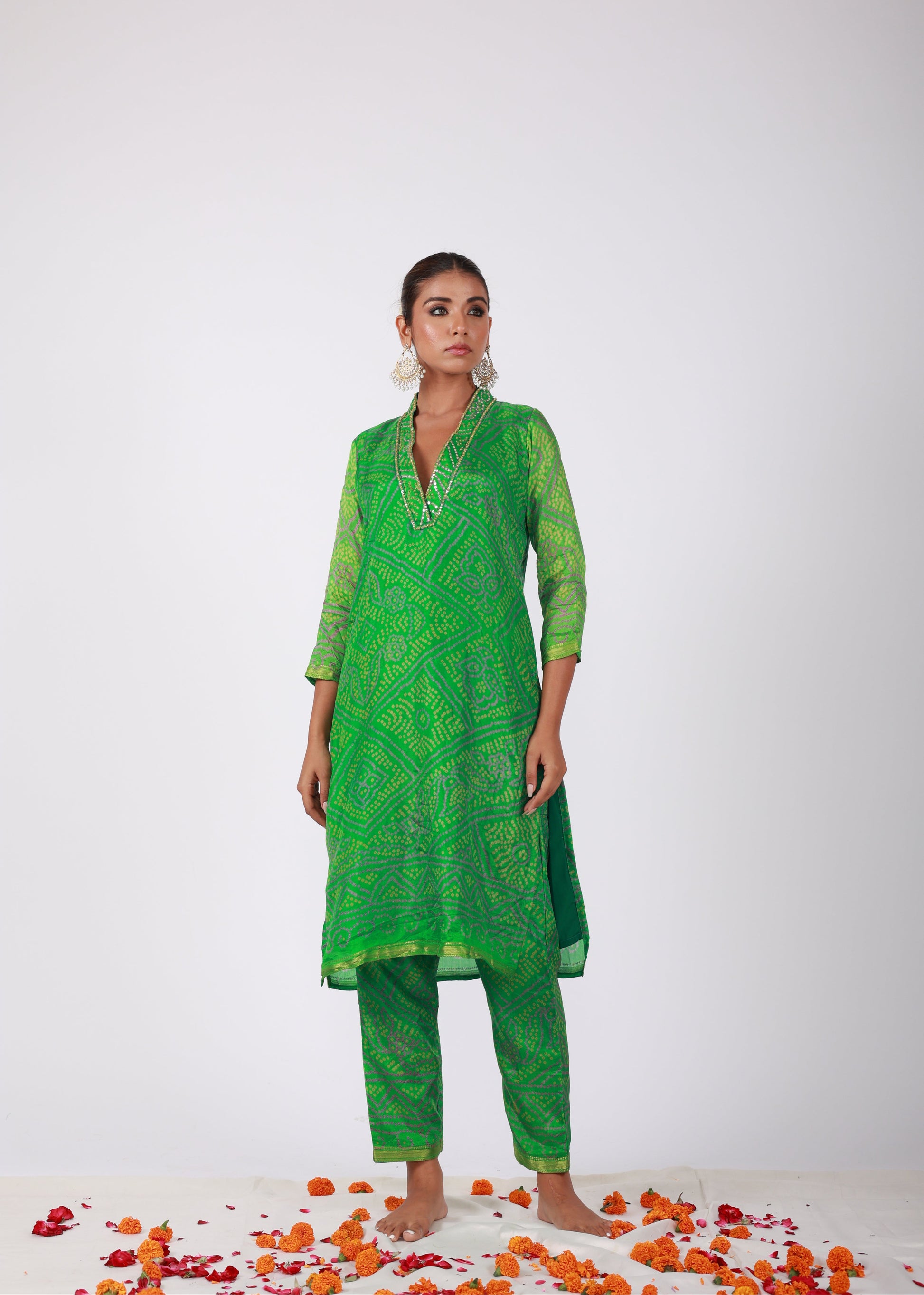 Model wearing the Roobroo green semi-silk kurta set with Bandhani print, embellished neckline, and matching pants – from That Romeo’s Roobroo Collection.