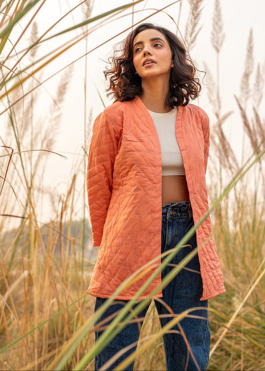 Model wearing ThatRomeo’s Cheery Peach Quilted Jacket — longline peach cotton jacket with open front and relaxed fit.