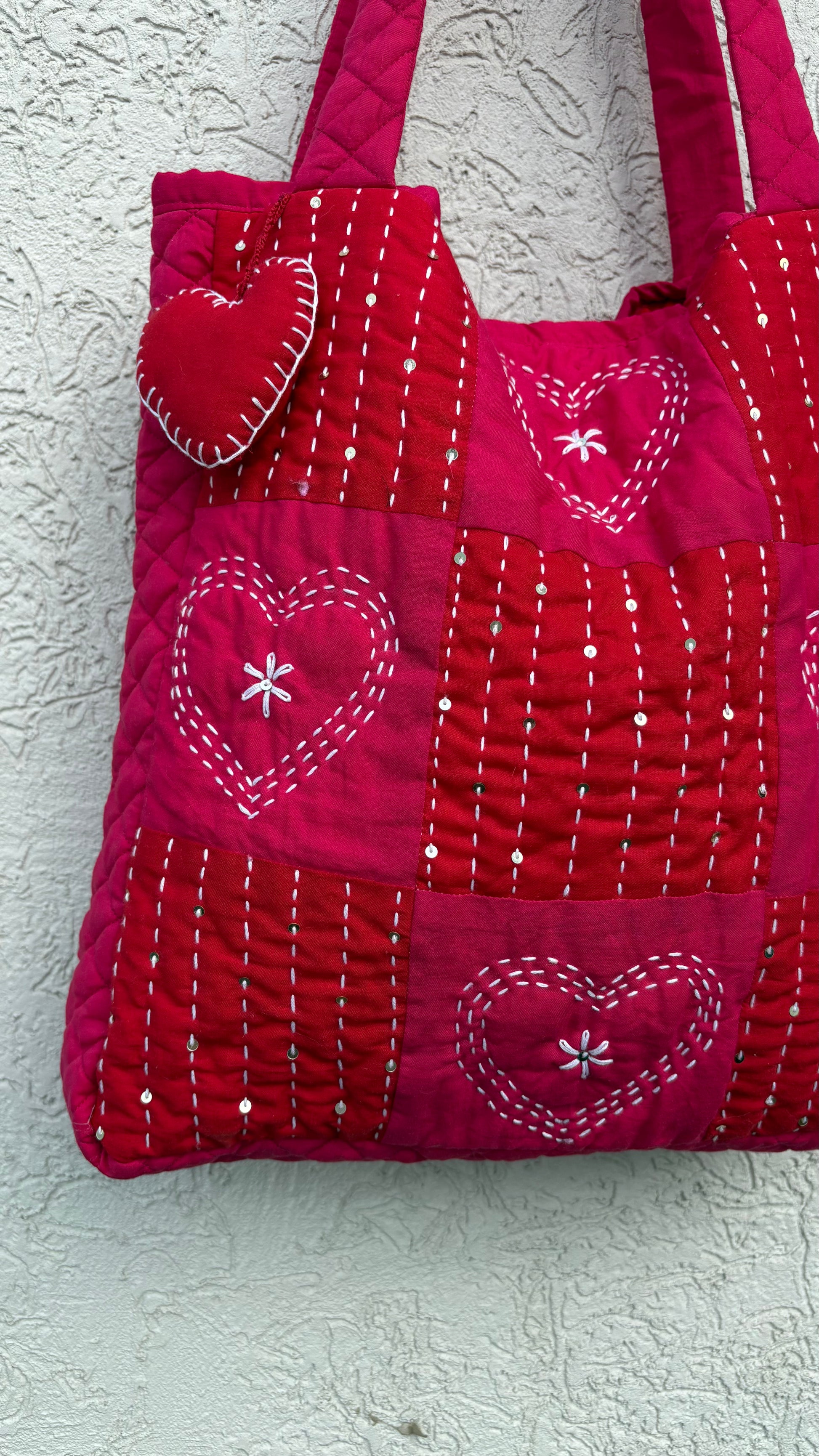 That Romeo handmade red quilted tote bag with heart-stitch Kantha embroidery and charm — made from upcycled fabric, eco-friendly and artisan-crafted