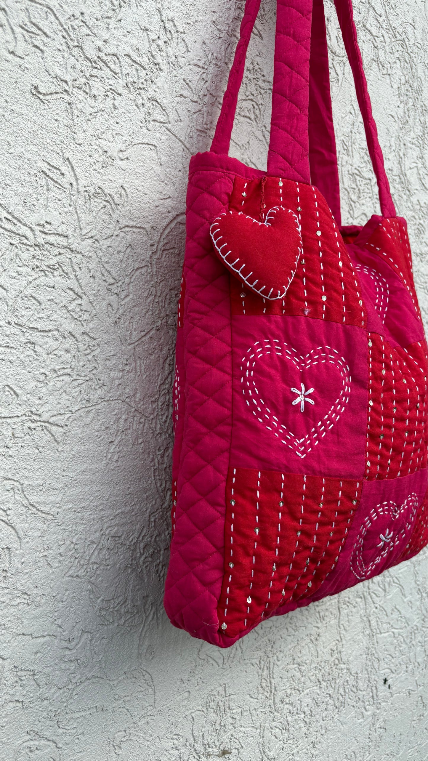 That Romeo handmade red quilted tote bag with heart-stitch Kantha embroidery and charm — made from upcycled fabric, eco-friendly and artisan-crafted