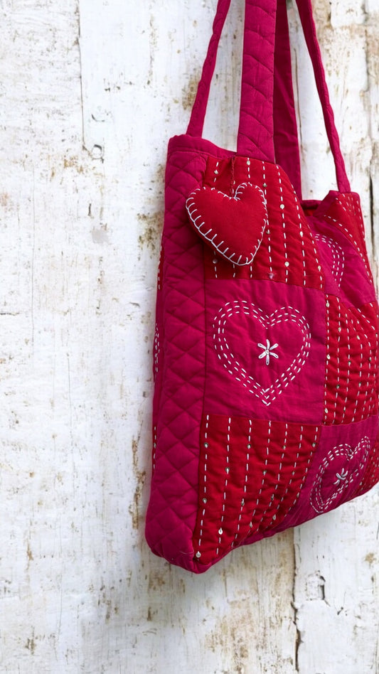 That Romeo handmade red quilted tote bag with heart-stitch Kantha embroidery and charm — made from upcycled fabric, eco-friendly and artisan-crafted