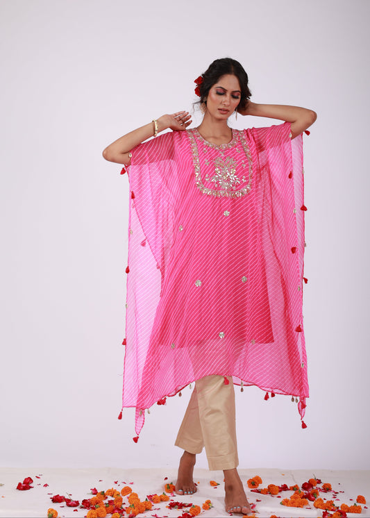 Model wearing the Roobroo pink georgette kaftan with gota patti embroidery, tassels, and light gold jam silk pants – a playful piece from That Romeo’s Roobroo Collection.