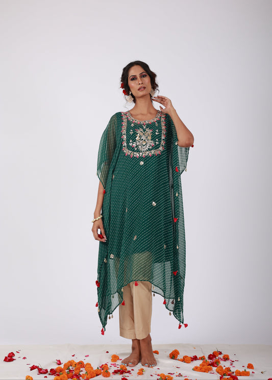 Model wearing the Roobroo green Leheriya georgette kaftan with intricate embroidery, handmade tassels, and light gold jam silk pants – part of That Romeo’s Roobroo Collection.