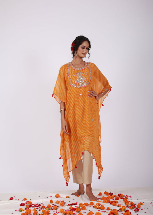 Model wearing the Roobroo chrome yellow georgette kaftan with gota patti and zari embroidery, handmade tassels, and gold jam silk pants – from That Romeo’s Roobroo Collection.