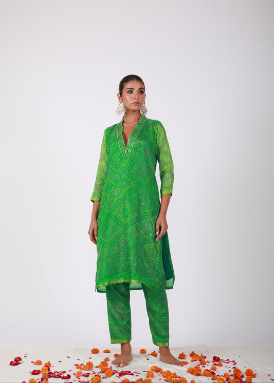 Model wearing the Roobroo green semi-silk kurta set with Bandhani print, embellished neckline, and matching pants – from That Romeo’s Roobroo Collection.