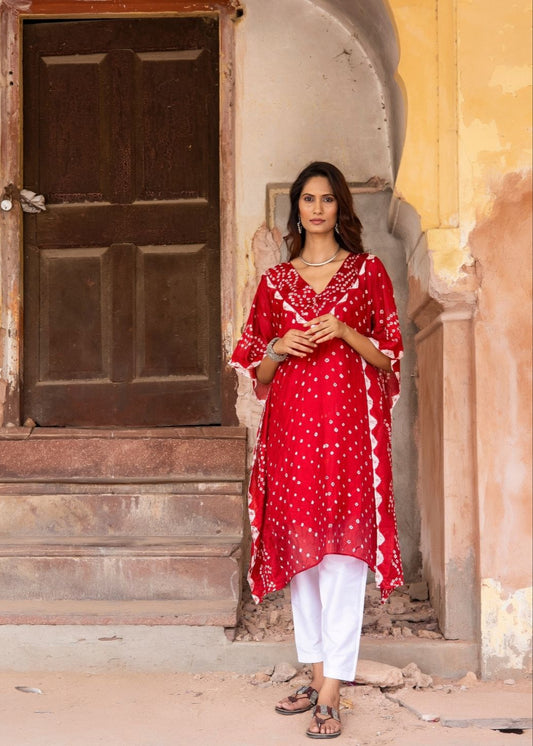 Model wearing the Gulaab red Bandhani semi-silk kaftan with traditional dot pattern and side detailing, styled with an inner – from That Romeo’s heritage Rangisaa Collection.
