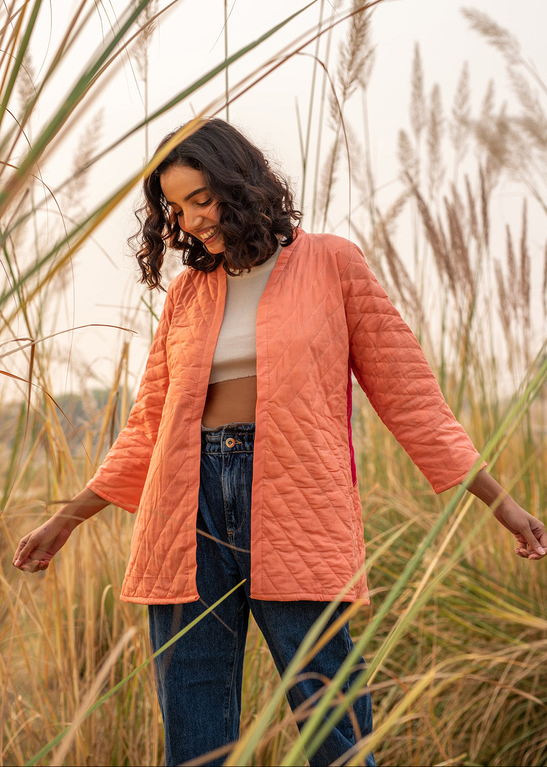 Model wearing ThatRomeo’s Cheery Peach Quilted Jacket — longline peach cotton jacket with open front and relaxed fit.