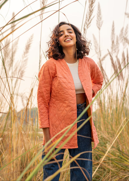 Model wearing ThatRomeo’s Cheery Peach Quilted Jacket — longline peach cotton jacket with open front and relaxed fit.