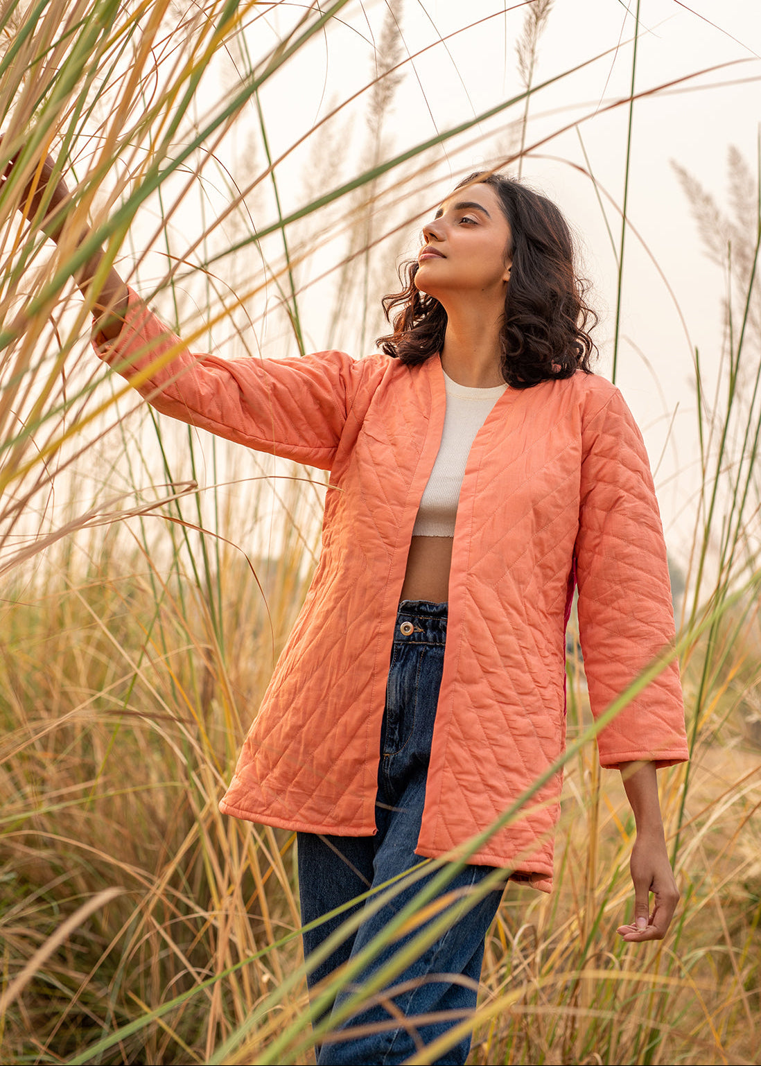 Model wearing ThatRomeo’s Cheery Peach Quilted Jacket — longline peach cotton jacket with open front and relaxed fit.