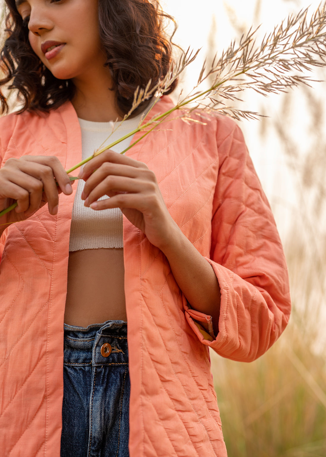 Model wearing ThatRomeo’s Cheery Peach Quilted Jacket — longline peach cotton jacket with open front and relaxed fit.