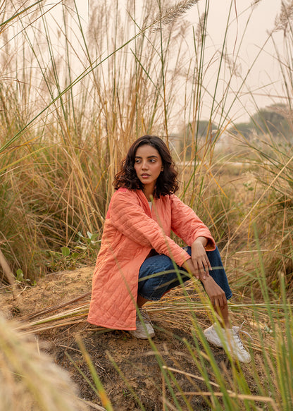 Model wearing ThatRomeo’s Cheery Peach Quilted Jacket — longline peach cotton jacket with open front and relaxed fit.