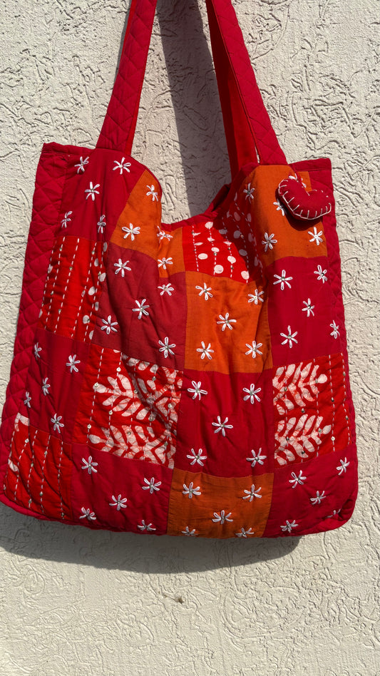 That Romeo handmade tote bag with floral Kantha embroidery, red-orange patchwork, and heart charm — eco-conscious, upcycled, and artisan-crafted