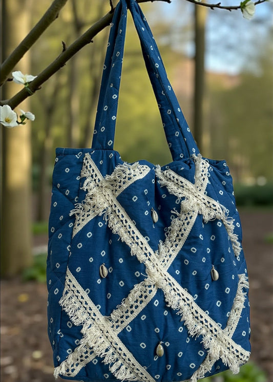 Blue Bandhani quilted tote bag by That Romeo with lace patchwork and shell embellishments.