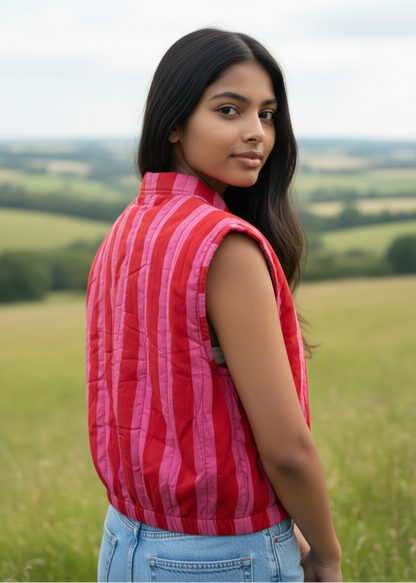 Model wearing ThatRomeo’s Berry Stripe Quilted Vest — pink striped cotton vest with quilted padding and open front.