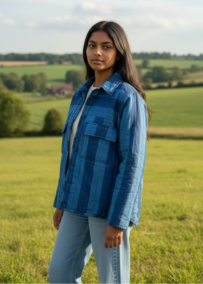 Model wearing ThatRomeo Blue Horizon Stripline Jacket — quilted cotton jacket in layered blue stripes with utility pockets.