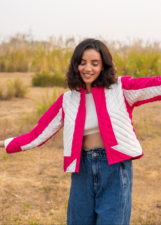 Model wearing ThatRomeo’s Candy Bolt Quilted Jacket — fuchsia and ivory cotton jacket with geometric pattern and open front.