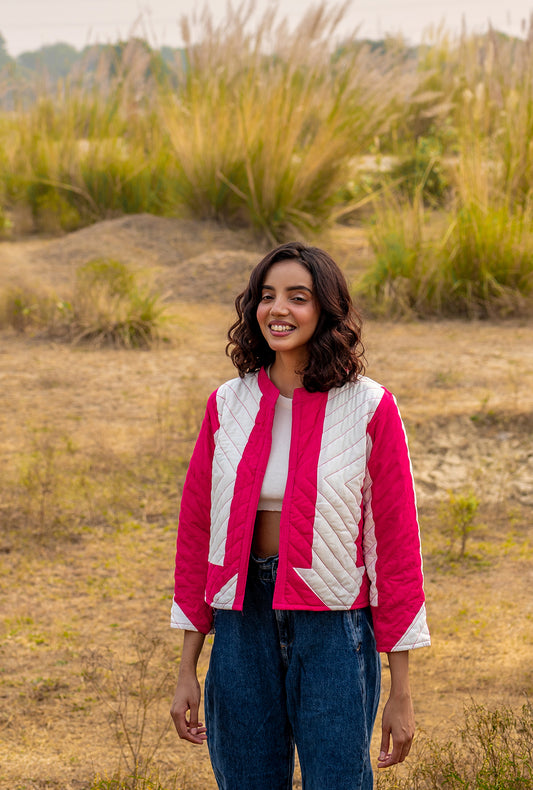 Model wearing ThatRomeo’s Candy Bolt Quilted Jacket — fuchsia and ivory cotton jacket with geometric pattern and open front.