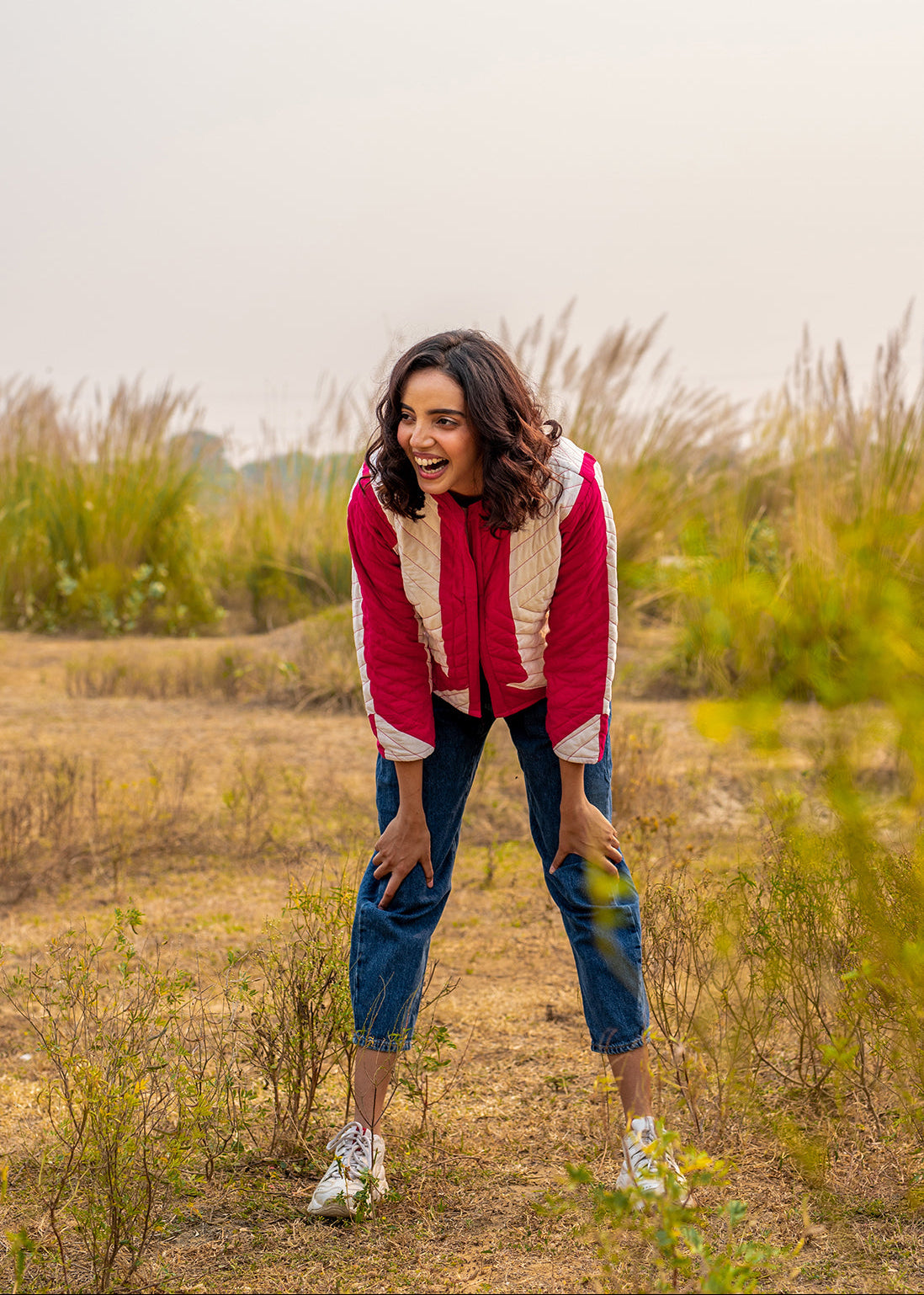 Model wearing ThatRomeo’s Candy Bolt Quilted Jacket — fuchsia and ivory cotton jacket with geometric pattern and open front.