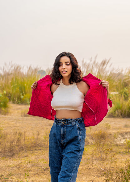 Model wearing ThatRomeo’s Candy Bolt Quilted Jacket — fuchsia and ivory cotton jacket with geometric pattern and open front.