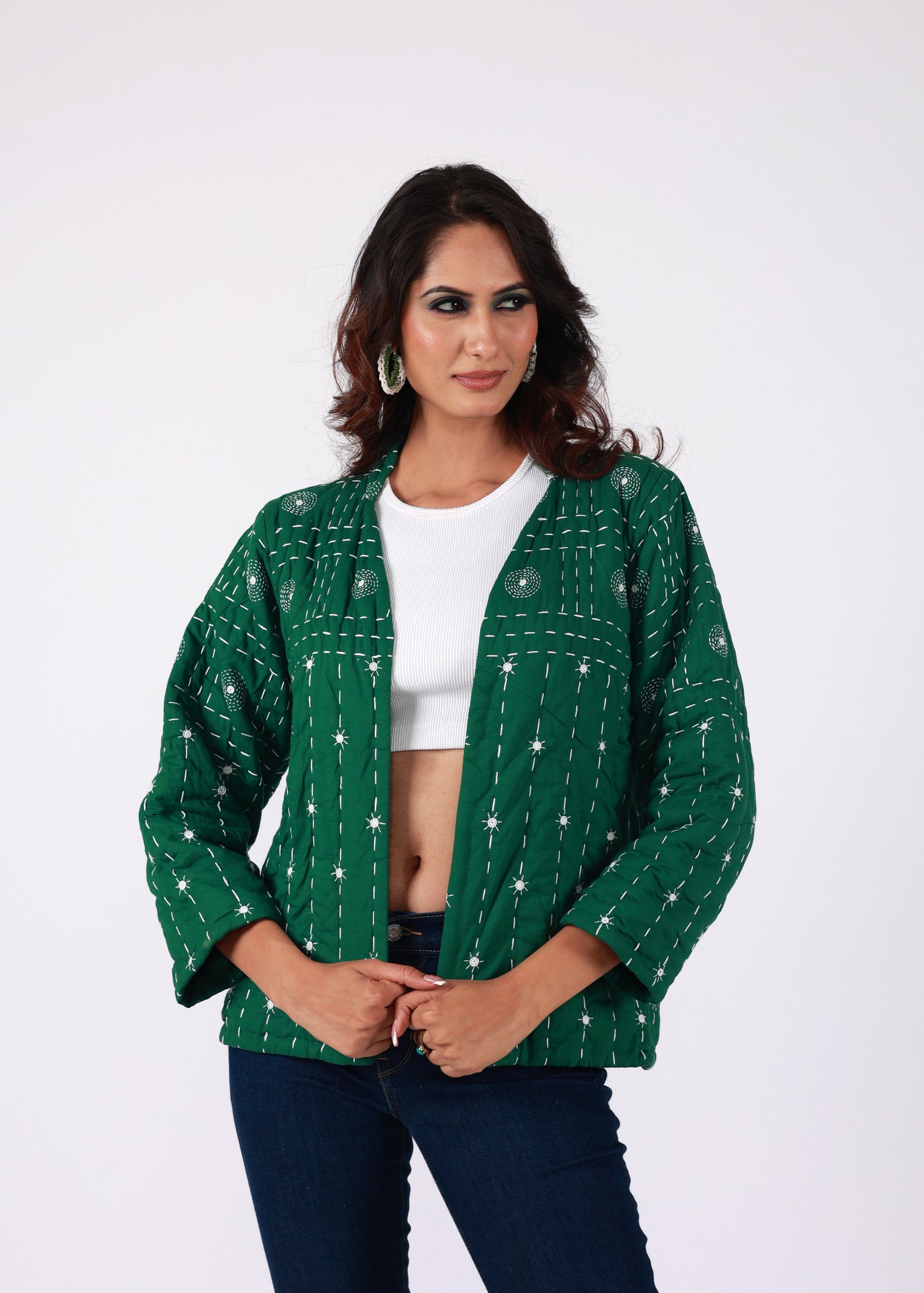 Model wearing ThatRomeo’s Emerald Echo Quilted Jacket — emerald green cotton jacket with white thread embroidery and open front.