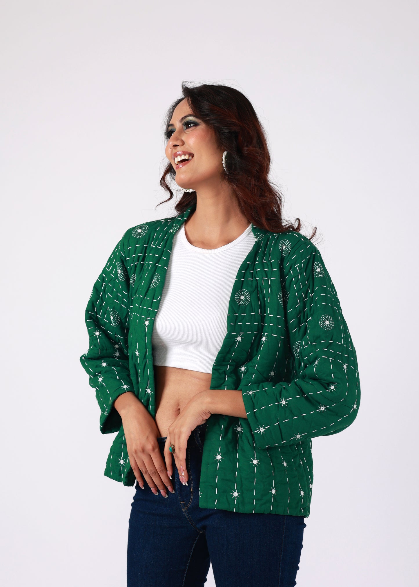 Model wearing ThatRomeo’s Emerald Echo Quilted Jacket — emerald green cotton jacket with white thread embroidery and open front.