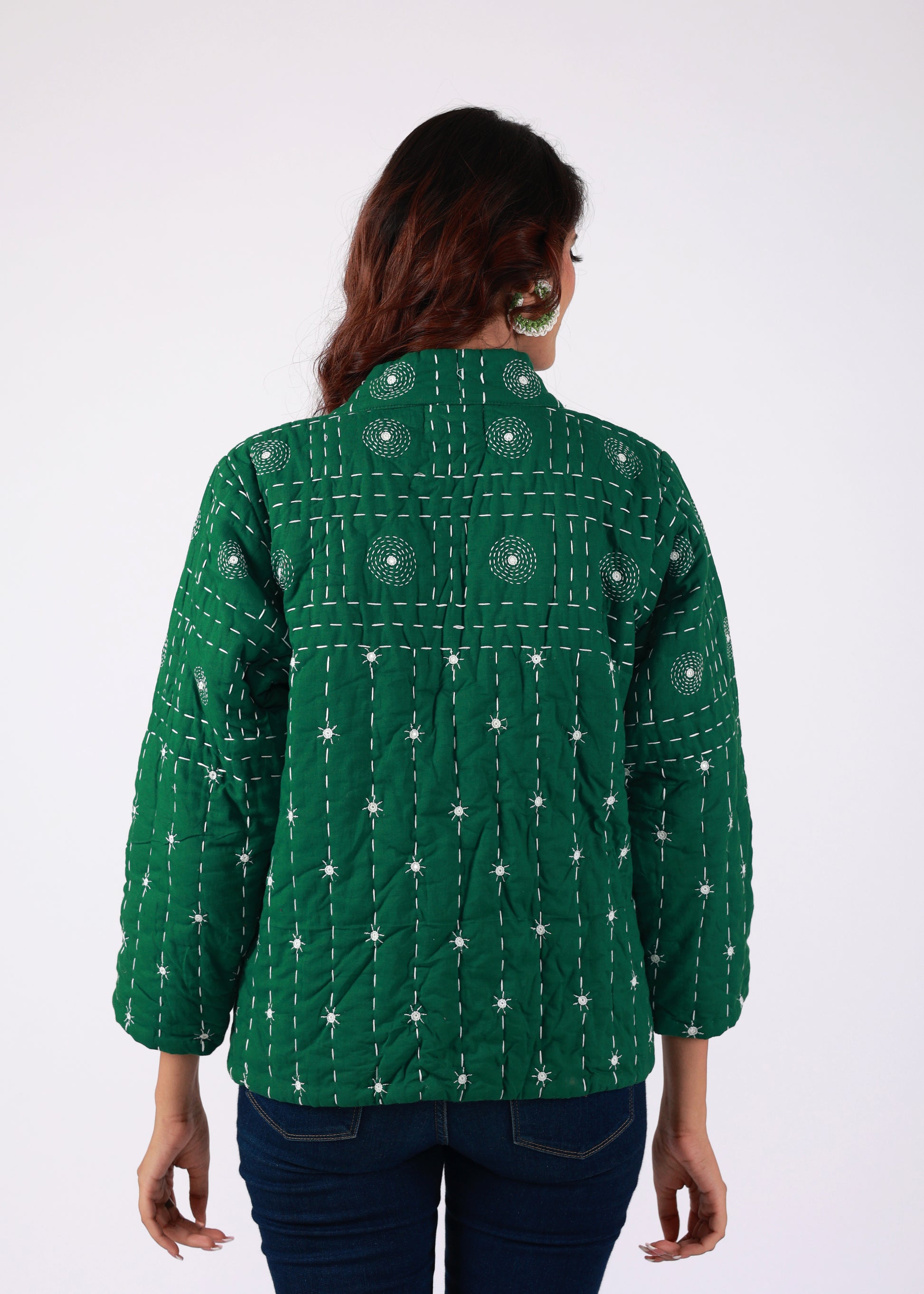 Model wearing ThatRomeo’s Emerald Echo Quilted Jacket — emerald green cotton jacket with white thread embroidery and open front.