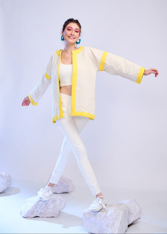Model wearing ThatRomeo’s Lemon Drift Quilted Jacket — off-white cotton jacket with yellow borders and relaxed fit.