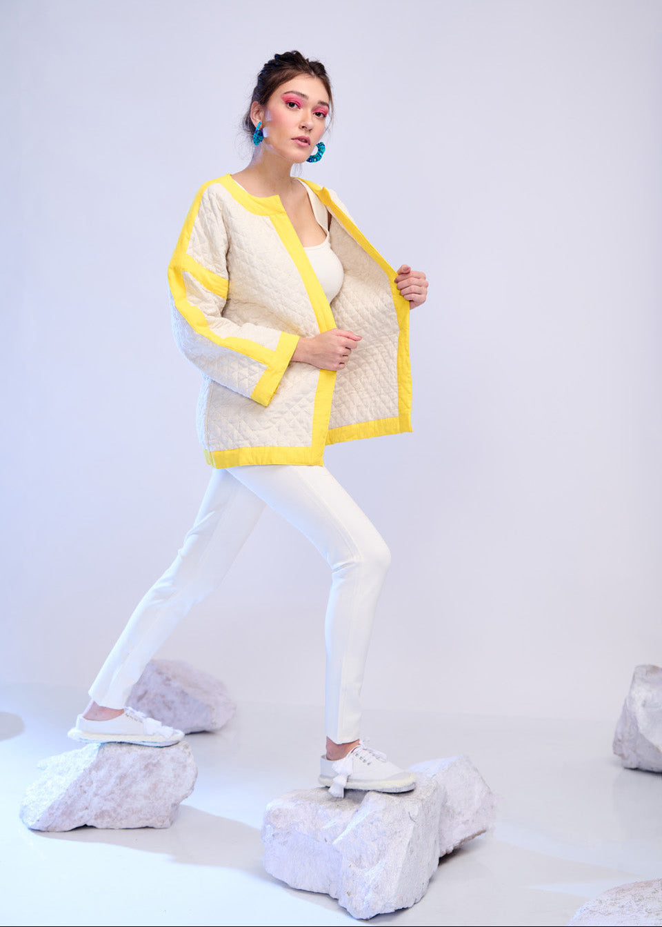 Model wearing ThatRomeo’s Lemon Drift Quilted Jacket — off-white cotton jacket with yellow borders and relaxed fit.