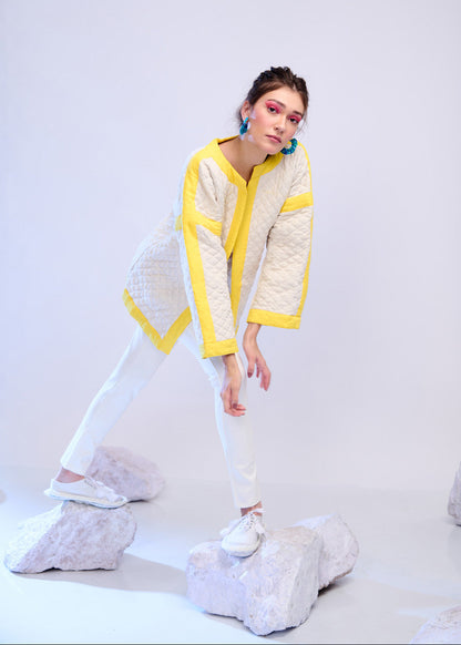 Model wearing ThatRomeo’s Lemon Drift Quilted Jacket — off-white cotton jacket with yellow borders and relaxed fit.