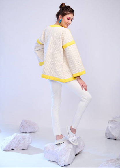Model wearing ThatRomeo’s Lemon Drift Quilted Jacket — off-white cotton jacket with yellow borders and relaxed fit.