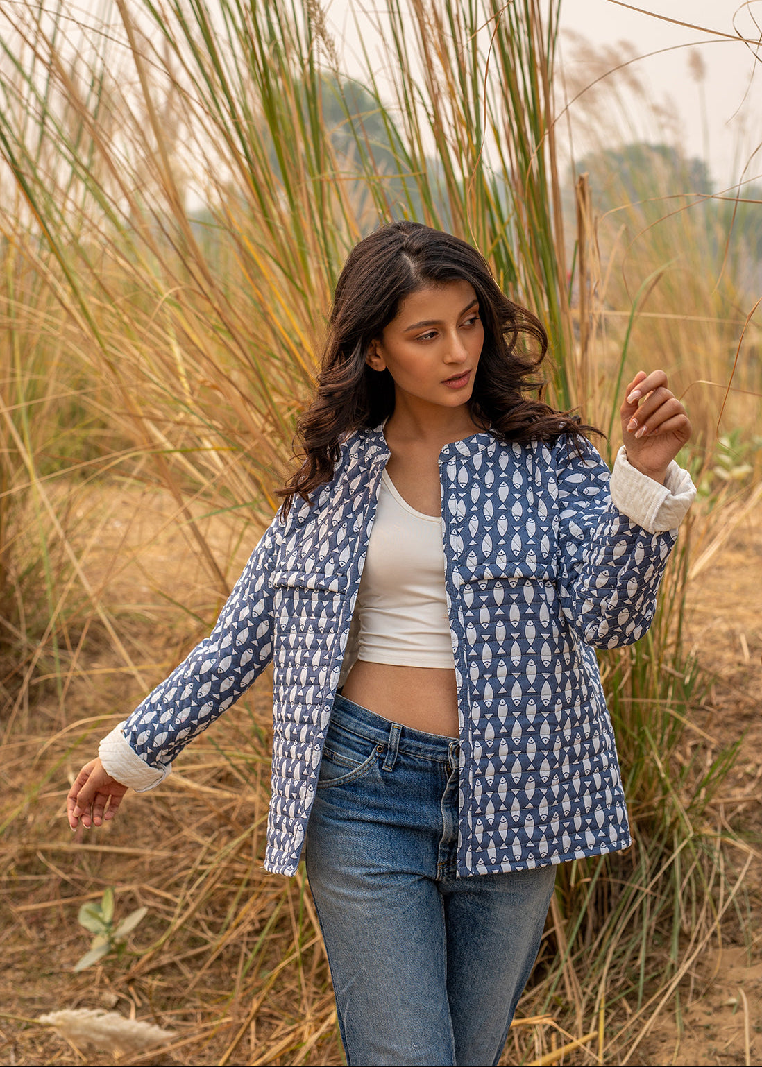 Model wearing ThatRomeo’s Memories Quilted Jacket — indigo printed cotton jacket with pockets and reversible cuff detail.