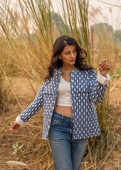 Model wearing ThatRomeo’s Memories Quilted Jacket — indigo printed cotton jacket with pockets and reversible cuff detail.