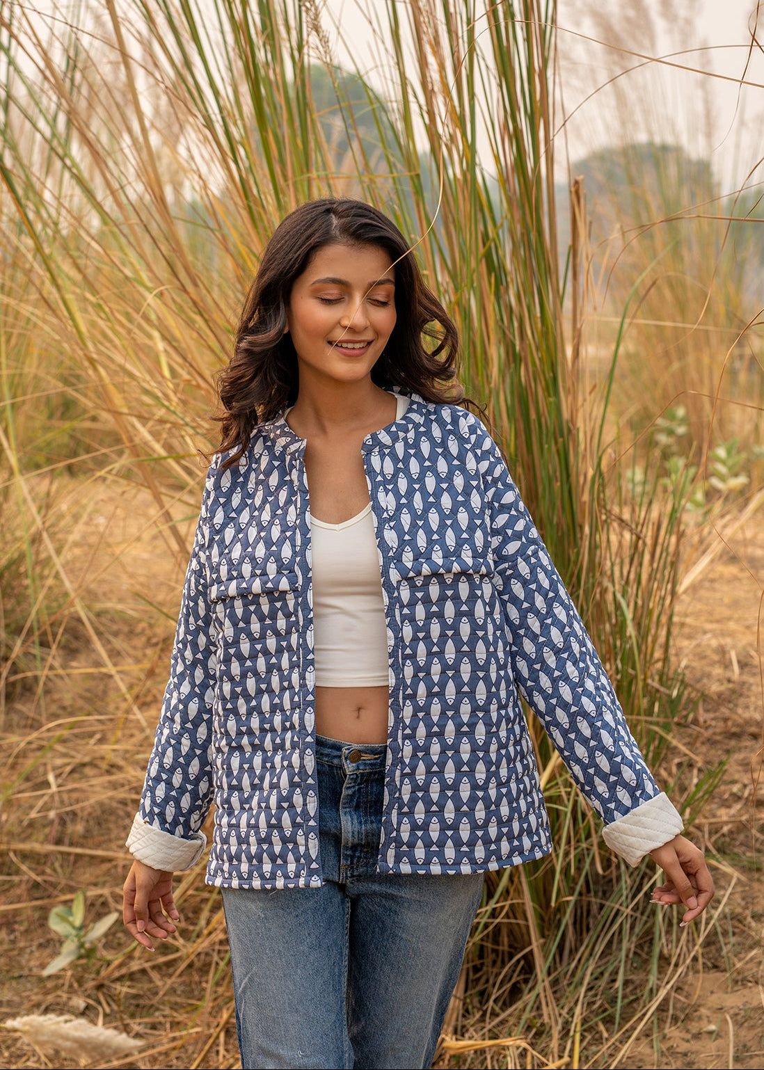 Model wearing ThatRomeo’s Memories Quilted Jacket — indigo printed cotton jacket with pockets and reversible cuff detail.