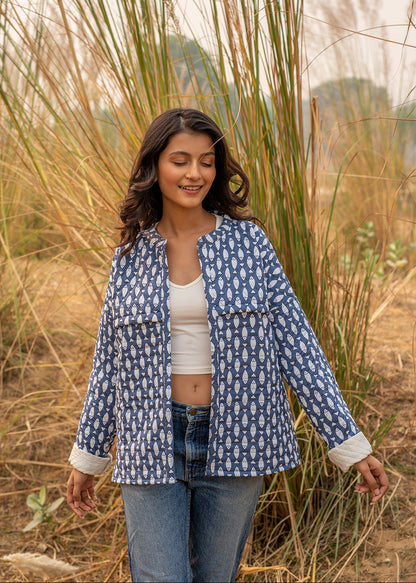 Model wearing ThatRomeo’s Memories Quilted Jacket — indigo printed cotton jacket with pockets and reversible cuff detail.