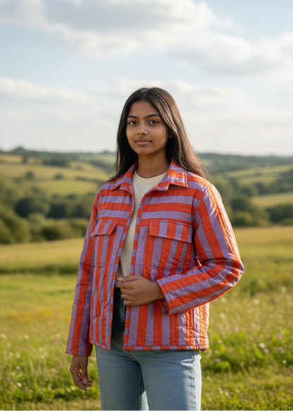 Model wearing ThatRomeo’s Sunset Stripe Quilted Jacket — orange and lavender striped cotton jacket with collar and pockets.