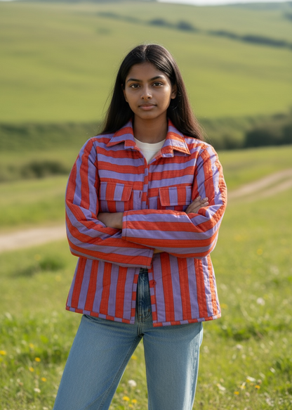 Model wearing ThatRomeo’s Sunset Stripe Quilted Jacket — orange and lavender striped cotton jacket with collar and pockets.