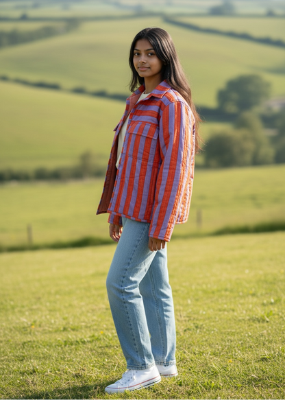 Model wearing ThatRomeo’s Sunset Stripe Quilted Jacket — orange and lavender striped cotton jacket with collar and pockets.